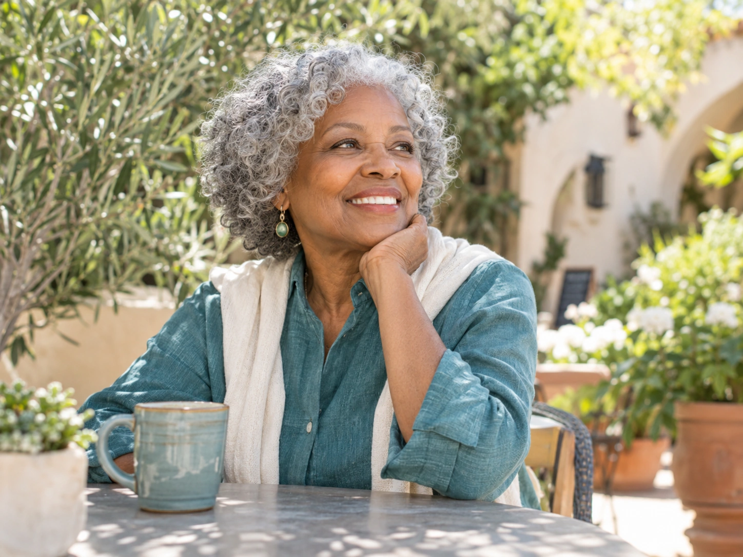 A woman enjoying a sunny garden